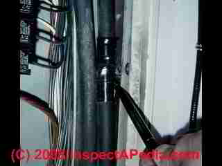 Electrical panel wire damage from cover screw (C) Daniel Friedman