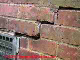 Step cracks in brick wall © D Friedman at InspectApedia.com 