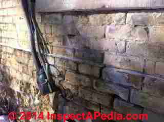 Spalling brick wall over gas heater vent (C) InspectAPedia RM
