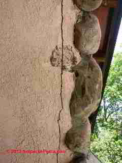 Stone veneer wall loose © D Friedman at InspectApedia.com 