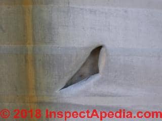 Hole cut into aluminum sidied structure (C) Daniel Friedman