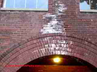 White deposits on brick walls effloresence © Daniel Friedman at InspectApedia.com