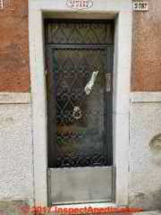 Door in Cannaregio Venice showing bottom panel seal against water entry during aqua alta (C) Daniel Friedman