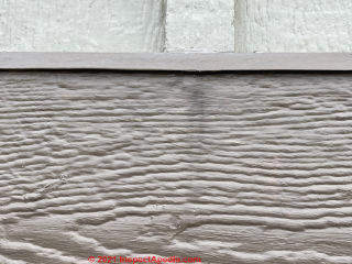 Stains on siding below battens (C) InspectApedia Tim
