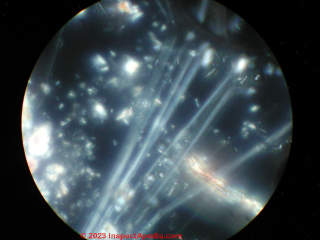 Asbestos insulation under the microscope at 1200x polarized light (C) InspectApedia.com Lapenna