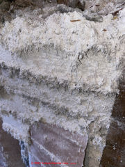 Asbestos insulation on building surface (C) InspectApedia.com Lapenna