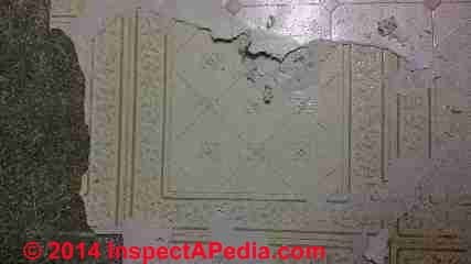 Peel and stick floor beneath sheet flooring from early 1980's (C) InspectApedia.com