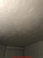 This textured paint ceiling or wall may contain asbestos (C) InspectApedia.com Kierean