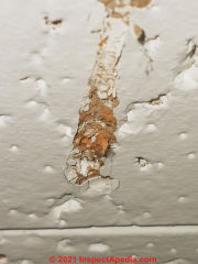 UK aoustic ceiling tile asbestos check (C) InspectApedia.com Joe 1980s