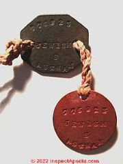 Vulcanized asbestos ID tags (C) InspectApedia.com John D included an ID number and the designation "Jewish" or religion