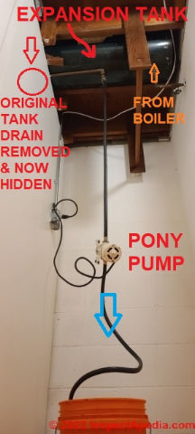How to use a pony pump to force-drain a heating boiler expansion tank (C) InspectApedia.com Daniel Kevin Angela