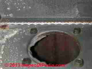 Rusted leak-suspect heat exchanger on a home heating furnace (C) Daniel Friedman