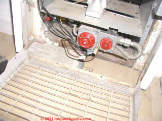 Gas controls and thermocouple at a gas heater (C) InspectApedia.com Karen