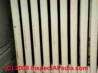 Splits and leaks in a cast iron radiator (C) Daniel Friedman