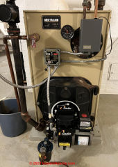 Weil Mclain WTGO-4 tankless oil boiler (C) InspectApedia.com David