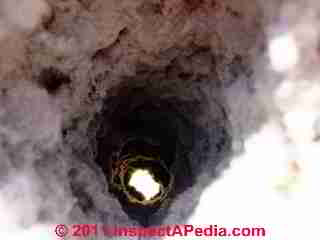 Clogged dryer vent duct © D Friedman at InspectApedia.com 
