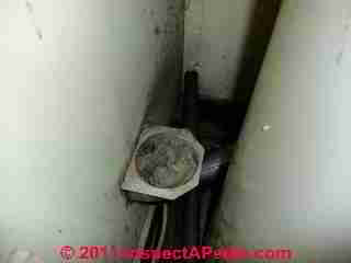 Dryer vent clog found behind the dryer installation © D Friedman at InspectApedia.com 
