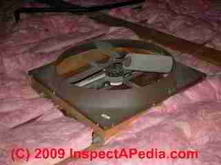 Whole house fan mounted in a ceiling, viewed from the attic (C) Daniel Friedman