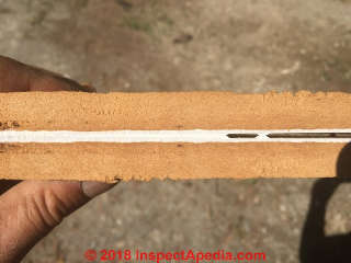 Cut and doubled-over fiberboard sheathing (C) InspectApedia.com EH