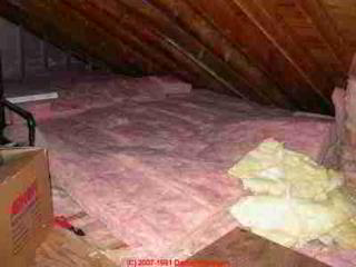 Fiberglass insulation added in an attic  (C) Daniel Friedman