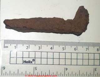 nail found in moss peatland (C) InspectApedia.com David