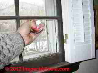 Broken window © D Friedman at InspectApedia.com 