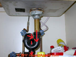 ABS plastic plumbing trap (black plastic) (C) Daniel Friedman InspectApedia.com