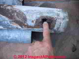 Corroded metal flue vent for gas water heater (C) Daniel Friedman