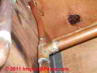 Clogged copper supply pipes © D Friedman at InspectApedia.com 