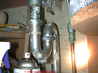 Chrome plated brass plumbing trap, badly corroded, leaky (C) Daniel Friedman InspectApedia.com