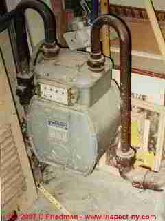 Photograph of a gas meter located next to a heating system return air inlet