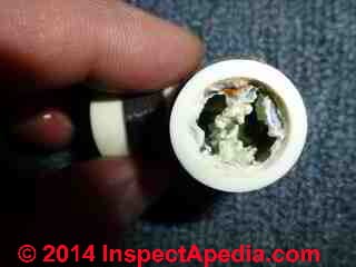 Brass PEX pipoing fitting corrosion (C) 2014 InspectApedia.com & Anon