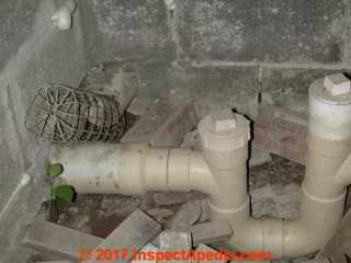 Building main drain trap on sewer line, PVC (C) Daniel Friedman InspectApedia.com
