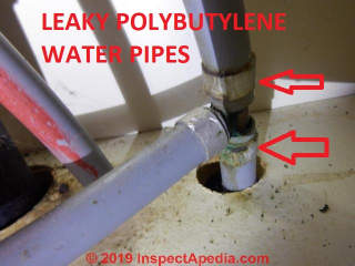 Leaky corroded clamp fittings on gray PB polybutylene pipe made by Vanguard (C) InspectApedia.com  Brad Barbour BNB Home Inspections Washington State