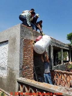 Rooftop gas tank installation in San Miguel de Allende, Guanajuato (C) Daniel Friedman