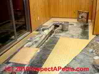 Photo of tranite cement-asbestos material used for air ducts in a slab over a sewer pipe (C) Daniel Friedman and Conrad