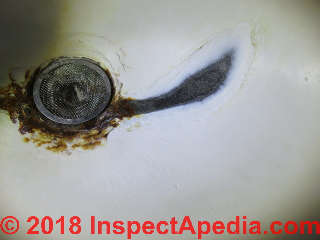 Badly corroded sink, prolonged faucet leakage (C) Daniel Friedman at InspectApedia.com