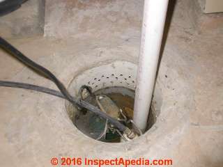 Sump pump pit with no cover and no visible check valve (C) Daniel Friedman