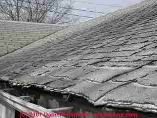 Curled, worn-out organic asphalt roof shingles