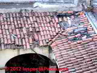 Clay tile roof with extensive damage © D Friedman at InspectApedia.com 