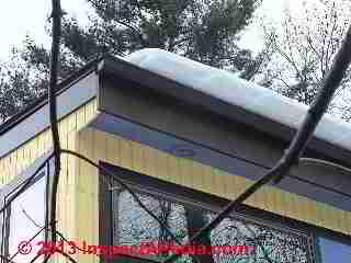 Snow sliding off of a metal roof (C) 2013 Daniel Friedman