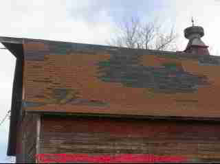 Wind damaged roof shingles (C) Daniel Friedman
