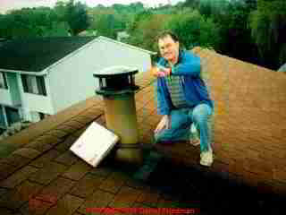Photograph of chimney soot stains on a roof.