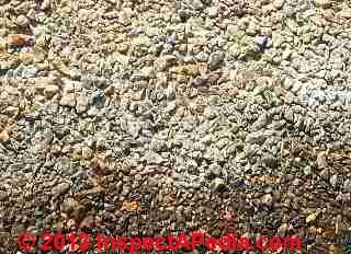 White stain material found on asphalt shingles (C) InspectApedia - & JM