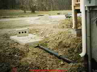 LARGER IMAGE: when you can see the SEPTIC TANK during installation or after finding it for a pumpout, that's a good time to measure off and record the exact location of the tank and its cleanout openings