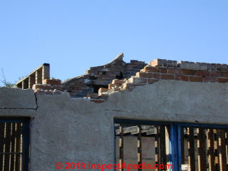 Collapsed brick parapet wall in Tucson (C) Daniel Friedman at InspectApedia.com
