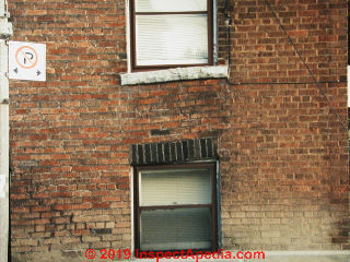 Brick wall settlement showing up at windows (C) Daniel Friedman at InspectApedia.com