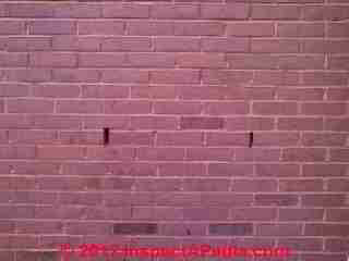 Cracks in brick veneer wall © Daniel Friedman at InspectApedia.com