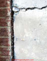 crack in concrete (C) InspectApedia.com Alma