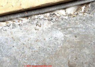 cracks on edge of concrete slab (C) InspectApedia.com Teresa